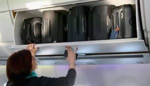  Cabin bag stowage in the overhead locker can work for everyone if you stow your case on its side with the bottom of the case against the back wall. 