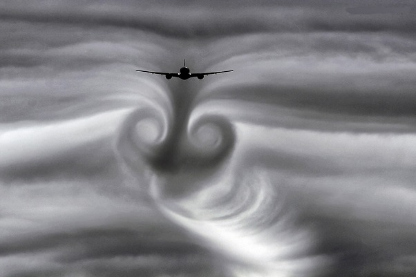 What causes turbulence? The effects of wake or aerodynamic turbulence are beautifully illustrated here as this aircraft passes through clouds.